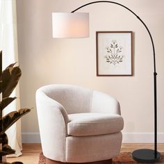 Inspired by a mid-century modern classic, our retro-cool arc floor lamp makes a statement; The tall arch silhouette reaches over your sofa or chair to provide a reading light in the living room, bedroom or office; Set the mood using the JONATHAN Y mobile app to dim the LED smart bulb and choose from thousands of colors JONATHAN Y 70-in Black Arc Floor Lamp | JYL8504A Elegant Floor Lamps, Stylish Floor Lamp, Arc Floor Lamp, Arched Floor Lamp, Arc Lamp, Smart Bulb, Room Ambiance, Led Floor, Overhead Lighting