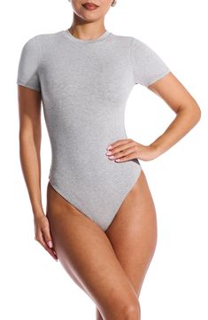 Sleek all-in-one style and breathable stretch jersey makes this T-shirt bodysuit a svelte option for all your plans. This form-fitting essential is made from the label's signature NW fabric, which is double lined, has four-way stretch, comfortable compression and a subtle crepe texture. Snap closure Crewneck Short sleeves Thong back Lined 95% viscose, 5% spandex Hand wash, line dry Imported Stretch Elastane Bodysuit With Crew Neck, Casual Fitted Seamless Leotard, Stretch Short Sleeve Bodysuit With Crew Neck, Summer Crew Neck Bodysuit For Loungewear, Stretch Smoothing Bodysuit For Loungewear, Fitted Basic Crew Neck Bodysuit, High Stretch Elastane Bodysuit With Crew Neck, Gray Short Sleeve Summer Bodysuit, High Stretch Elastane Crew Neck Bodysuit