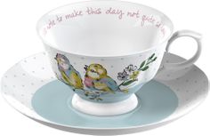 a cup and saucer with birds painted on it