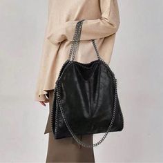 Black Luxe Soft Vegan Leather Chain Shoulder Tote Bag, Faux Leather , Ships In 7-8 Days Chic Faux Leather Bag With Chain Strap, Black Chain Shoulder Bag For Everyday Use, Trendy Leather Shoulder Bag With Chain, Black Shoulder Bag With Chain In Tote Shape, Evening Shoulder Bag With Chain Strap In Faux Leather, Chic Faux Leather Shoulder Bag With Chain Strap, Black Chain Shoulder Bag Tote, Evening Faux Leather Shoulder Bag With Chain Strap, Black Tote Shoulder Bag With Chain