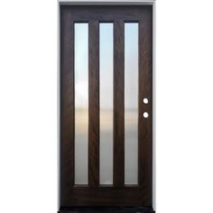 the front door is made from wood and has frosted glass panels on each side