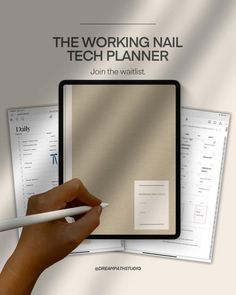 the working nail tech planner is being held by a hand with a pen in it