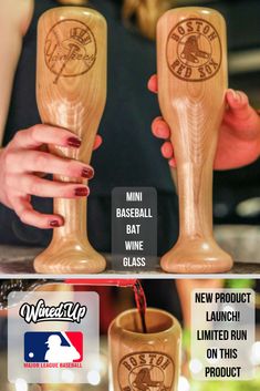 two wooden wine glasses with logos on them