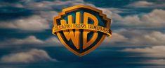 the logo for warner bros pictures is shown in front of clouds and blue sky with white clouds