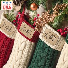 three christmas stockings hanging from a tree with writing on them that says made in usa