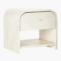 a white wooden night stand with an open drawer