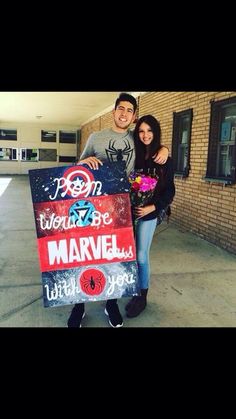 a man and woman standing in front of a building holding a sign that says, you can't be married