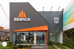 a building with an orange and black sign in front of it that says edifica