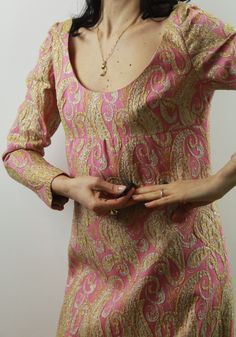 Vintage late 60s pink and gold brocade evening maxi dress. So stunning. Size 8/10 uk. Fully lined. Excellent vintage conditions. Shipping of this item takes one week for dry cleaning. I wish the dress is perfect for you! All items are vintage and used. However they are all in good to excellent condition. Any defect is specified. Sometimes, small signs of use are to be considered normal. No exchanges and returns, but ask me everything you need! Fitted Pink Brocade Dress, Pink Brocade Dress For Formal Occasions, Pink Brocade Dress For Festive Occasions, Elegant Pink Maxi Dress For Festive Occasion, Festive Pink Fitted Maxi Dress, Festive Fitted Pink Maxi Dress, Festive Vintage Pink Dress, Fitted Pink Maxi Dress For Festive Occasions, Brocade Evening Dress