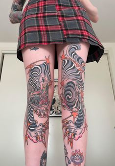 a woman with tattoos on her legs