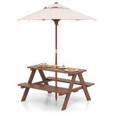 a picnic table with an umbrella over it and plates of food on the table under it