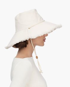 Women's elegant canvas sunhat for sale online, features a fringed edge and adjustable chin strap, which will secure it on the windiest of days. This soft, floppy hat is lightweight, breathable and provides complete coverage for your face, neck and ears. Soft, lightweight and packable. Rolls and folds into a tote bag. Brim span: 4.5" Adjustable chin strap. Durable 12 oz canvas 50+ UPF rating for the best in sun protection Blocks 95% of UVA/UVB rays Dry clean only. Small Leather Accessories, Art Costume, Gold Sand, Women's Headwear, Costume Institute, Navy Linen, Natural Gold, Vanity Fair, Leather Accessories