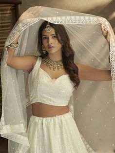 Buy enchanting white georgette embroidered lehenga choli for celebrating upcoming diwali festival celebration. Shop this elegant lehenga choli which comes with georgette blouse and georgette dupatta. White Lehenga With Intricate Embroidery For Party, White Lehenga With Intricate Embroidery In Georgette, White Georgette Choli With Intricate Embroidery, White Georgette Lehenga With Resham Embroidery, White Lehenga With Traditional Drape For Party, Festive White Georgette Lehenga, White Lehenga For Wedding And Navratri, White Sharara For Wedding And Navratri, White Semi-stitched Lehenga With Resham Embroidery