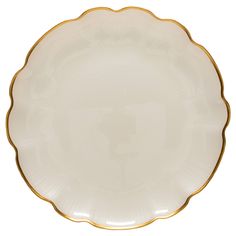 an empty white plate with gold trim