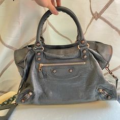 Cool Dark Grey Balenciaga Bag. The Bag Is A Little Roughed Up But There Are No Major Flaws(Minor Can Be Seen In The Photos). It’s Is A Medium Size Shoulder Bag. Grey Balenciaga, Purple Balenciaga Bag, Red Balenciaga, Balenciaga Purse, Balenciaga Classic City, Balenciaga Motorcycle Bag, Balenciaga Tote, Balenciaga Belt, Balenciaga Metallic Purse