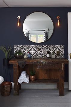 a bathroom with a sink and mirror in it