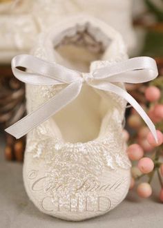 a pair of white shoes sitting on top of a table