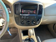 the interior of a car with steering wheel controls