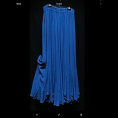 Moroccan Cotton Rayon Blend Blue Flowy Skirted Bottoms, Casual Flowy Blue Skirt, Blue Flowy Bottoms, Elegant Blue Stretch Maxi Skirt, Chic Flowy Blue Skirt, Chic Flowy Blue Bottoms, Flowy Long Blue Skirt, Chic Blue Stretch Maxi Skirt, Chic Blue Flared Maxi Skirt