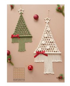 three christmas trees made out of crochet on a pink surface with ornaments around them