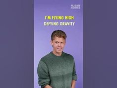 a man standing in front of a purple background with the words i'm flying high defying gravity