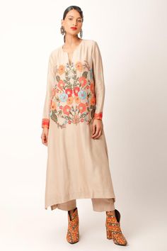 Beige kurta with abstract patch, zari work sleeve borders, multi color floral thread and bead embroidery. Paired with straight fit pant.
Components: 2
Pattern: Embroidered and Printed
Type Of Work: Applique, Thread and Zari Work
Neckline: Notched Round Neck
Sleeve Type: Full Sleeves
Fabric: Silk Chanderi, Cotton Slub
Color: Beige
Other Details: 
Side slits on kurta
Length:
Kurta: 48 inches
Pant: 35 inches
Note: The dupatta worn by the model is not for sale
Occasion: Puja,Mehendi and Haldi - Aza Beige Kurta, Kurta Pant Set, Beige Silk, Straight Fit Pants, Zari Work, Kurta With Pants, Fabric Silk, Full Sleeves, Bead Embroidery