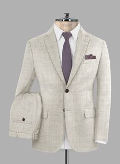 You can't go wrong with a neutral color palette, and our Italian Aime Ivory Gray Wool Suit ticks all the boxes. Made with super 120s merino wool, which will keep you warm in winter and cool in summer, it showcases an ivory gray colorway with a decent solid weave, making it a perfect match for both high-end elegance and practical purposes. This suit will be your new go-to for all occasions. 
 
 Look features a 2 button jacket with notch lapels, f aux horn brown    buttons, single vent, two cuff b Grey Wool Suit, Solid Texture, Button Jacket, Gray Suit, Wool Suit, Neutral Colour Palette, Jacket Buttons, Neutral Color, Wool Fabric