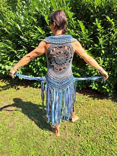 Blue Sleeveless Vest For Festival, Bohemian Fitted Sleeveless Vest, Fitted Bohemian Sleeveless Vest, Sleeveless Stretch Crochet Top For Festivals, Fitted Bohemian Crochet Vest Top, Bohemian Fitted Vest For Beach, Fitted Sleeveless Crochet Top For Festival, Hippie Style Fitted Sleeveless Vest, Fitted Sleeveless Hippie Vest