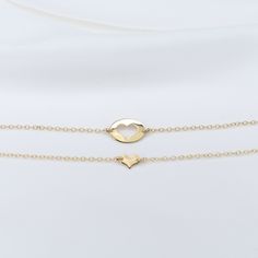 Mother Daughter bracelet set Mother's bracelet: - 14K gold charm is about 14mm x 10mm. - 14K gold 1.3mm cable chain Daughter's bracelet: - 14K gold heart charm is about 8mm x 6mm. - 14K gold 1.3mm cable chain 14K gold components To see other Mother daughter set click here: https://www.etsy.com/shop/SashJewelry?section_id=12441134&ref=shopsection_leftnav_1 To see more children's jewelry click on the link below. http://www.etsy.com/shop/SashJewelry?section_id=12441132 To see more Sash Jewelry Yellow Gold Sterling Silver Heart Bracelet For Anniversary, Gold Hypoallergenic Double Heart Jewelry, Yellow Gold Heart Bracelet For Anniversary On Mother's Day, Dainty Yellow Gold Heart Bracelet For Mother's Day, Yellow Gold Double Heart Necklace As Gift For Her, Mother's Day 14k Gold Dainty Bracelet, Yellow Gold Double Heart Jewelry As Gift For Her, Classic Gold Heart Bracelet As Gift, Hypoallergenic Yellow Gold Heart Pendant Jewelry