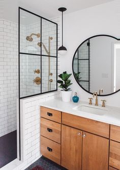 a bathroom with two sinks and a large mirror