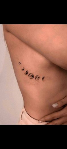 a woman's stomach with the word love written in small letters on her side