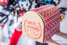 a red and white mailbox with the words'letter to noel'written on it