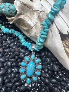 "Concho Boho Western Chain Necklace This Necklace has a med size turquoise concho pendant Semi Stone. The chain is adjustable it is filled with Turquoise Nuggets small. You can wear it alone or for an extra dramatic look , you can layer it with more of your favorite in different lengths. -Burnished Silver  - Colored Stone, Turquoise Chips -16\"length 3\" extender - 2\"x 1.5\" pendent drop - Lobster clasp closure - Burnished Silver and Colored stone This listing is for the small sized choker style necklace." Western Style Turquoise Dangle Jewelry, Western Style Nickel-free Turquoise Necklace, Southwestern Style Blue Necklace With Large Pendant, Southwestern Turquoise Necklace With Oval Pendant, Southwestern Style Turquoise Oval Pendant Necklace, Southwestern Turquoise Oval Pendant Necklace, Blue Southwestern Necklace With Large Pendant, Turquoise Pendant Beaded Necklace With Adjustable Fit, Bohemian Turquoise Oval Pendant For Jewelry Making