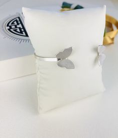 Add some nature to your stack with this open style butterfly bangle. Finished in a brushed design. Fits wrists up to 7.4 inches Silver Bracelets Butterfly, Silver Butterfly Bracelets For Gifts, Sterling Silver Butterfly Bracelets, Adjustable Silver Nature-inspired Cuff Bracelet, Butterfly-shaped Sterling Silver Bracelet, Gold Hoops, Silver Bracelets, Sterling Silver Bracelets, Air Jordans