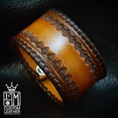 "This brown leather cuff bracelet is custom dyed in a light brown fade to dark chocolate edges . It's stamped inside the perimeter and the edges are whipstitched in chocolate leather lace. Two hand distressed snaps provide the closure. A great width for any wrist! I'll need your wrist size for this cuff! Please use the instructions in the pics above! - 1.5\" wide - Hand-tooled and stamped - Laced edge Thanks for checking out my work! I use a fine hand in my work bridging the gap between Art &amp Artisan Brown Concho Cuff Bracelet, Artisan Brown Cuff Bracelet With Concho, Vintage Hand-tooled Brown Leather Bracelet, Rustic Brown Concho Bracelets, Rustic Brown Bracelet With Concho, Vintage Brown Hand Tooled Cuff Bracelet, Vintage Brown Hand-tooled Cuff Bracelet, Vintage Hand-tooled Brown Cuff Bracelet, Brown Leather Concho Bracelet