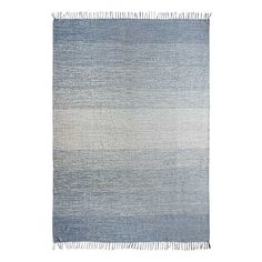 a blue and white rug with fringes on the bottom, in front of a white background