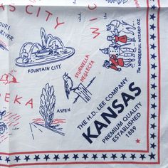 an old kansas tea towel with the words kansas printed in red, white and blue