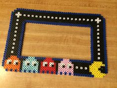 an old nintendo game console is made out of perler beads