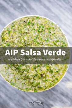 a white bowl filled with food on top of a wooden table and the words app salsa verde