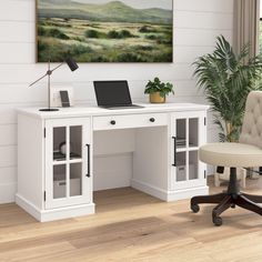 a white desk with a laptop on it and a chair in front of the desk