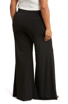 A wide leg and an elastic waist further the casually cool attitude of these pull-on pants that are right for work and play. 32" inseam; 14" front rise (size 1X) 95% polyester, 5% spandex Machine wash, line dry Made in the USA Model stats: 5'10" height, 32" bust, 25" waist, 36" hip. Model is wearing size Small. Versatile Black Pull-on Pants, 4-way Stretch Wide Leg Trousers With Elastic Waistband, Versatile Wide Leg Pull-on Pants, Wide Leg Bottoms With Pull-on Style And 4-way Stretch, Black Pull-on Wide Leg Pants, Wide Leg Bottoms With Elastic Waistband And 4-way Stretch, 4-way Stretch Wide Leg Pants With Elastic Waistband, Black Wide Leg Pants With Pull-on Style, Wide Leg Pants With Elastic Waistband And 4-way Stretch