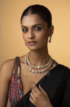 An elegant and classic polki necklace set is the design that offers delicate hints of traditional legacies and Victorian art forms of zirconia setting to bejewel your neckline. Embedded with uncut Polkis this beauty is designed and handcrafted by artisans of India with traditional jewelry-making techniques. Embellish your appearance with our Polki-inspired necklace that has a resemblance to Sabyasachi jewelry. Add this charm of Indian Jewelry to your wardrobe and see the heads turn. A perfect enchanting piece of jewelry that is both dramatic and elegant is here to assist you on your special days.  Necklace Closure - Adjustable Dori Earrings Closure - Push Back  Style Tip - Being a strong supporter of the intersection of classic and contemporary, we love designs that are contemporary yet bo Elegant Temple Necklace With Tilla For Parties, Elegant Cutdana Temple Necklace For Reception, Elegant Kundan Necklace With Gota Work For Festivals, Elegant Festive Jewelry With Gota Work, Elegant Temple Necklace For Diwali Party, Elegant Kundan Necklace With Cutdana For Party, Elegant Kundan Necklace With Cutdana For Reception, Elegant Party Kundan Necklace With Cutdana, Elegant Temple Necklace With Gota Work For Diwali