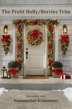 the front door is decorated for christmas with wreaths and lights