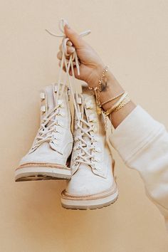 Our best selling combat boot is back by popular demand! Our WHITNY lace up combat boot in sandstone canvas looks great paired with floral dresses to distressed jeans. The Carter, Gold And Silver Jewelry, Charms Bracelets, Stay Grounded, Lace Up Combat Boots, Combat Boot, Everyday Shoes, Floral Dresses, Lug Sole