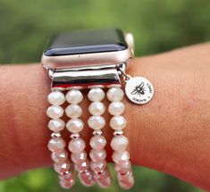 PLEASE read ENTIRE listing BEFORE purchasing These gorgeous custom watch bands are the perfect arm candy for your Apple Watch! Choose your color scheme and you're ready to rock your arm stack, watch in tow! Note: *These bands fit 38mm and 40mm Apple Watch faces ONLY and are ONE SIZE to fit an average-large sized wrist. I do not offer custom sizes, so please be sure that this band will work for you prior to purchasing. *Stretching the band over the user's hand is not recommended as this could bre Customizable Adjustable Silver Watch Bands, Adjustable Personalized White Watch Bands, Personalized Adjustable White Watch Bands, Customizable Adjustable Apple Watch Band As Gift, Customizable Adjustable White Apple Watch Band, Adjustable White Watch Accessories For Gifts, White Adjustable Watch Accessories For Gift, Customizable White Watch Bands For Gift, Customizable White Watch Bands As Gift