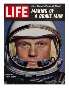 a magazine cover with a man in an astronaut's helmet