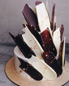 a cake with chocolate and white frosting on top