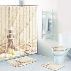 a bathroom with a shower curtain, toilet and rugs on the floor in front of it