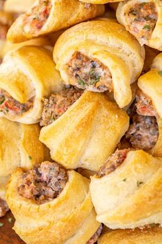 several rolls with meat and cheese on them