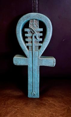 an ancient egyptian symbol is displayed on a table